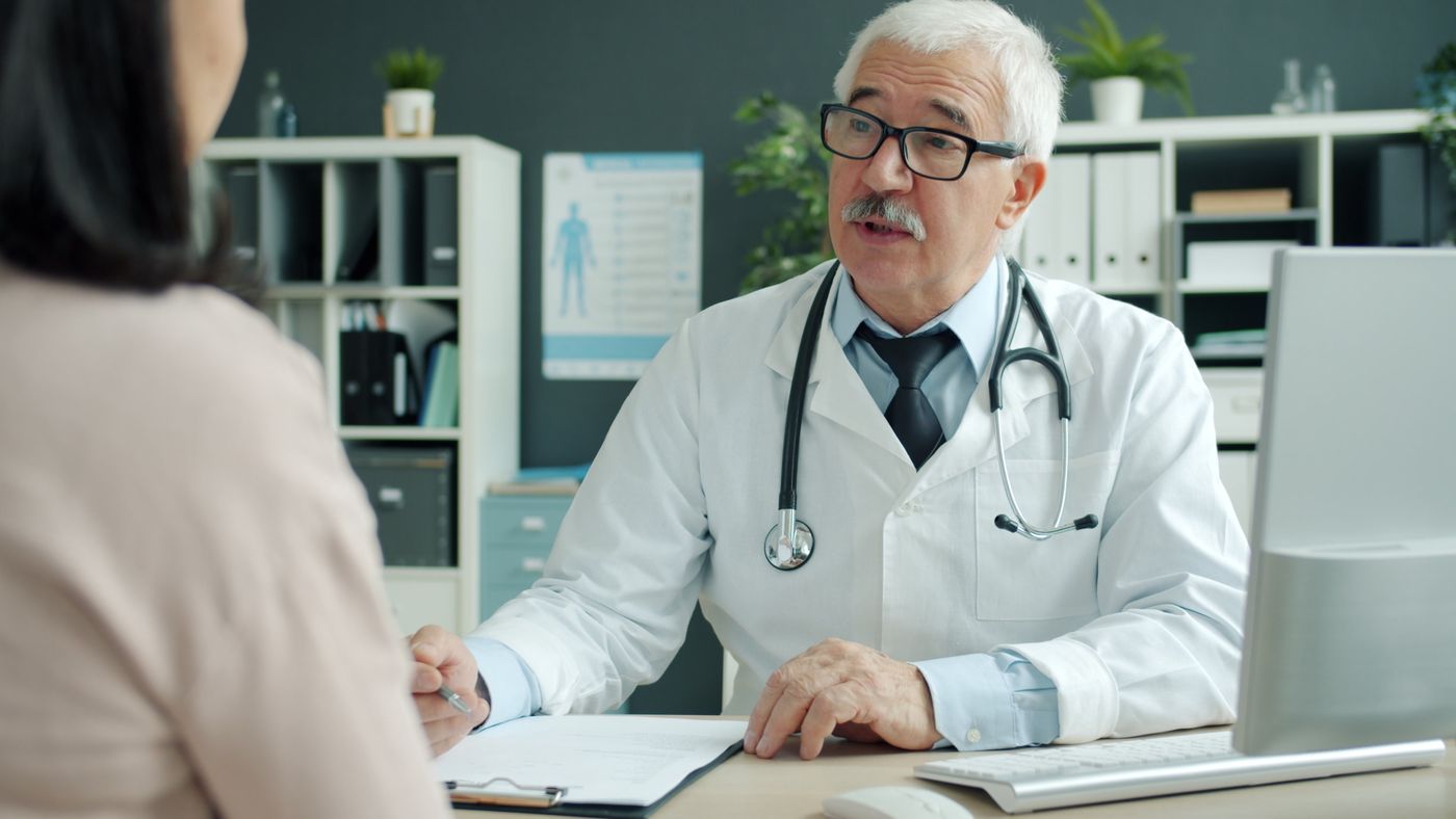 Doctor talking with a patient during a consultation